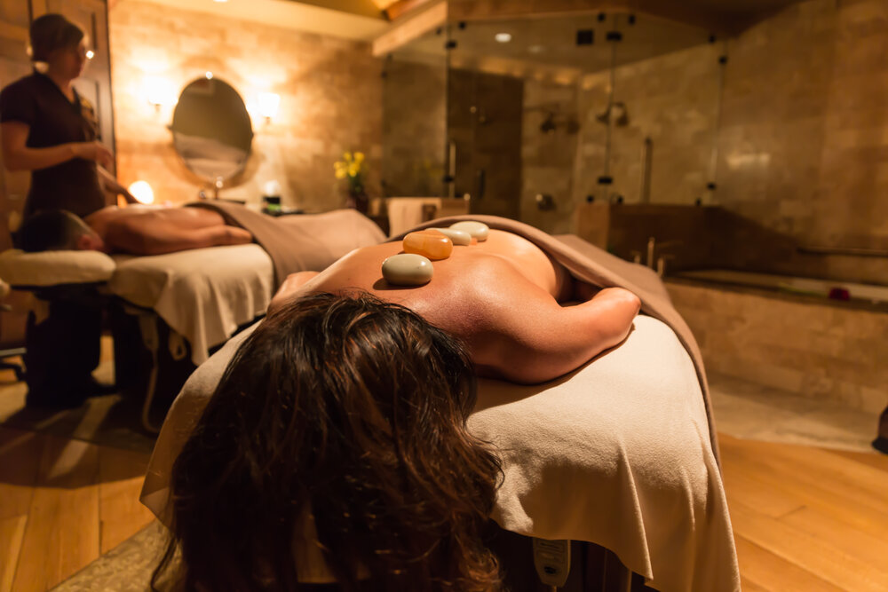 Couples getting hot stone massage at Stein Eriksen